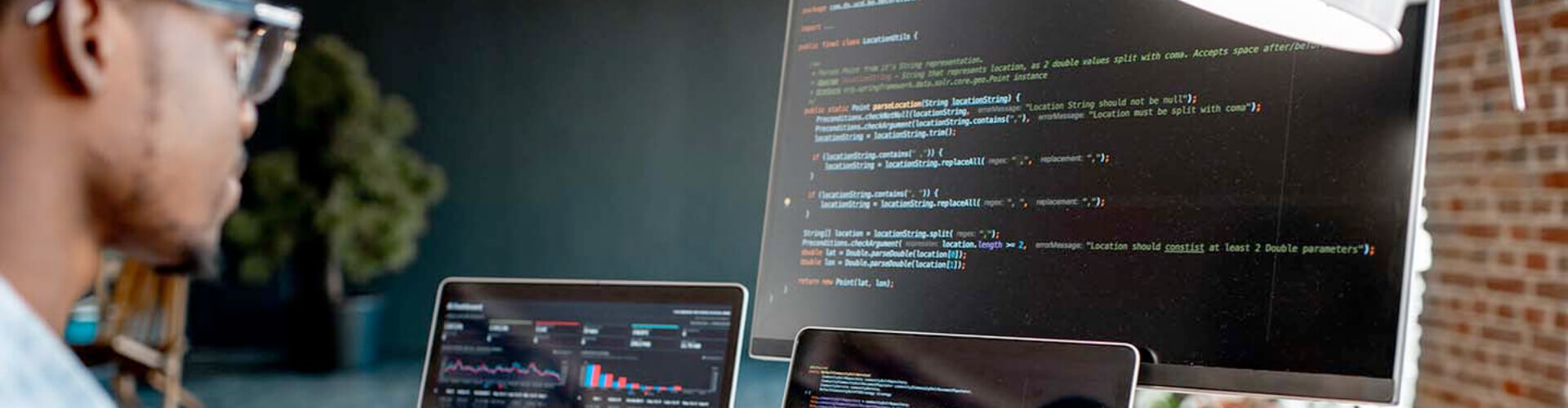 Programmers sitting in an office collaborating